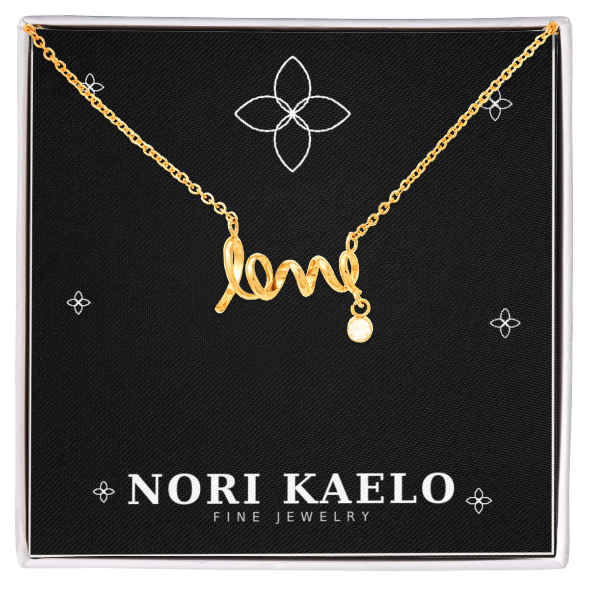 Cursive love pendant necklace in yellow gold finish, displayed on a black Nori Kaelo Fine Jewelry gift box.